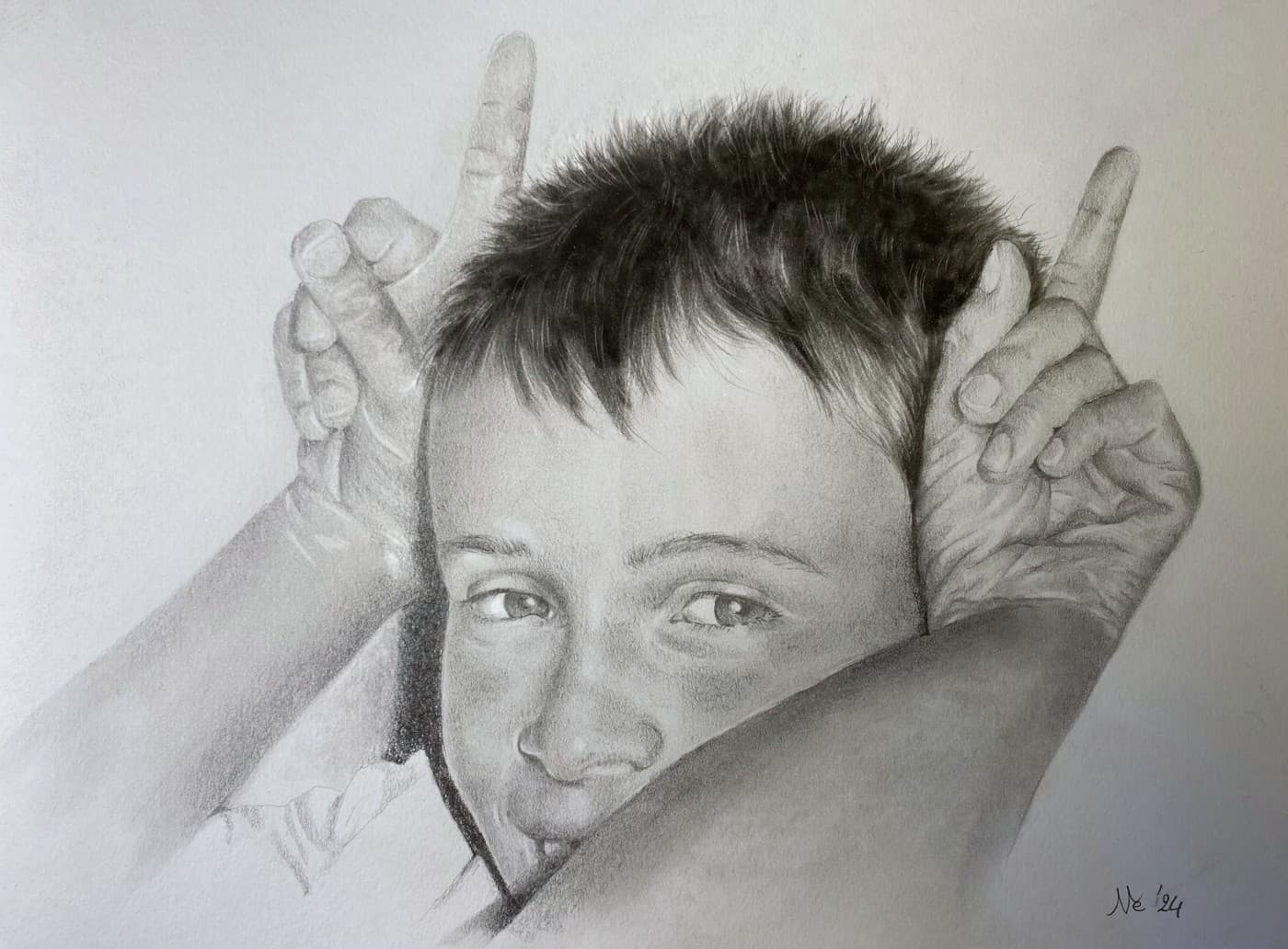 Pencil portrait of a boy making a playful hand gesture, resting his chin on an arm.