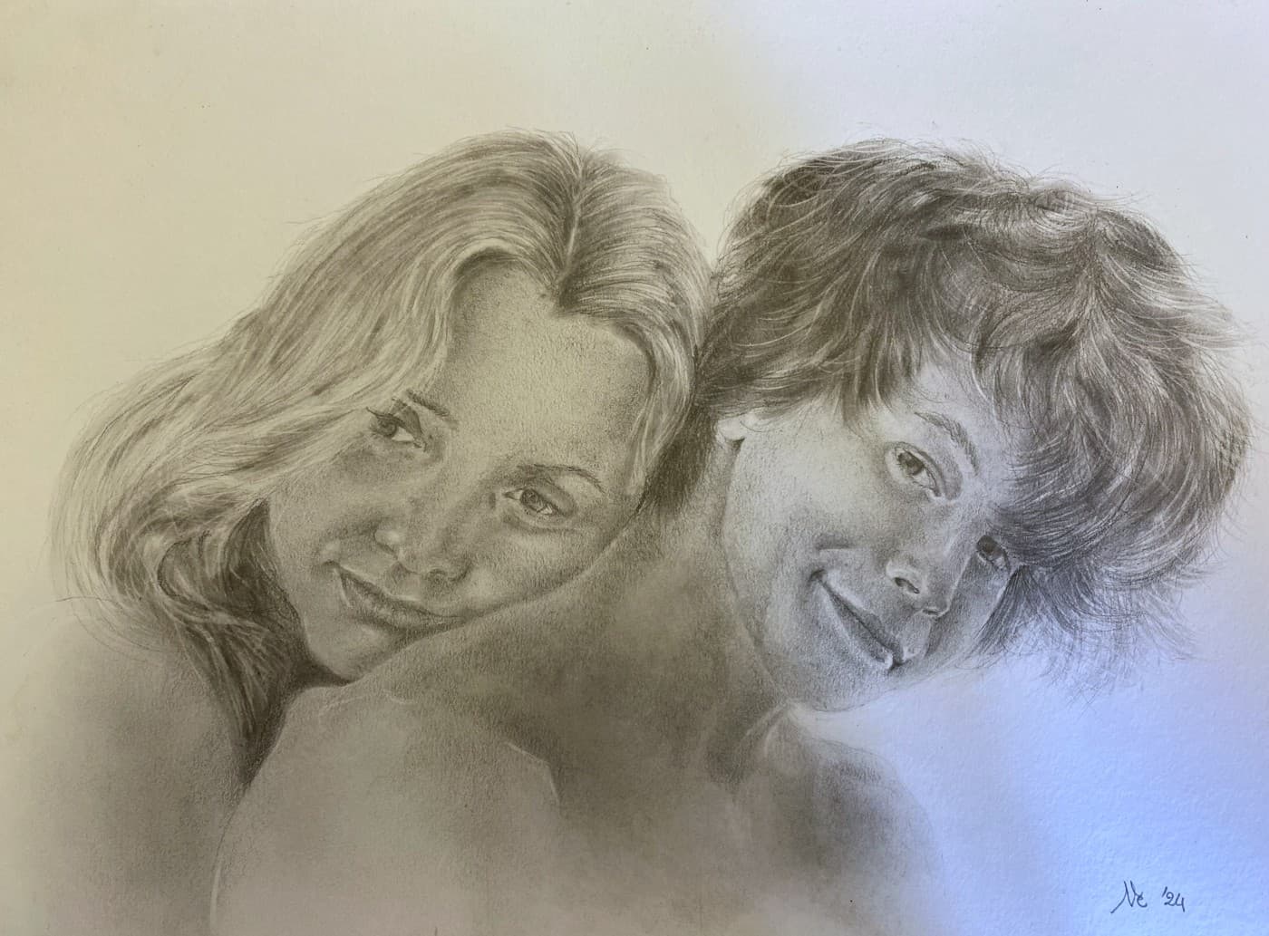 Pencil double portrait of two smiling young women, cheek to cheek.